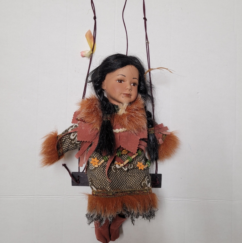 Cathay Collection Indian Porcelain Doll, sitting on a swing
